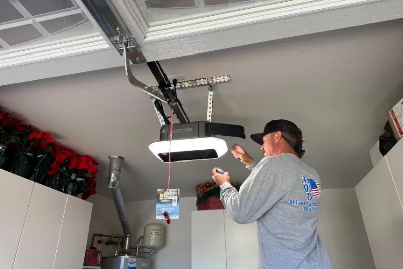 Employee Installing Garage Door Opener